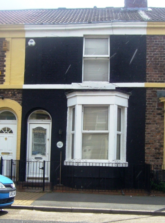 46 Merlin Street today: a small black-painted Victorian terrace with a bay window